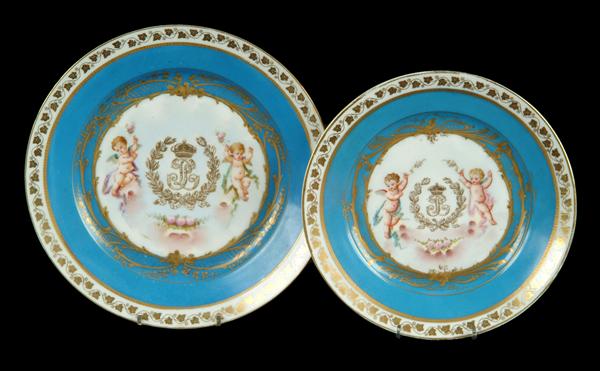 Appraisal: Two similar Sevres-style turquoise ground plates probably Limoges decorated with