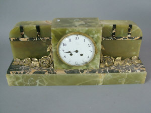 Appraisal: An Art Deco onyx marble and gilt bronze mantel clock