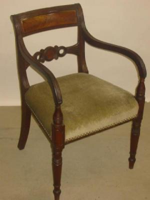 Appraisal: A REGENCY MAHOGANY ELBOW CHAIR with brass stringing panelled top