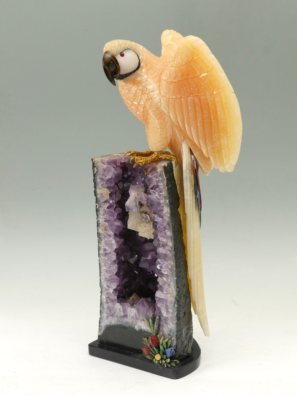 Appraisal: GEM CARVED PARROT ON AMETHYST GEODE Body is of Aragonite