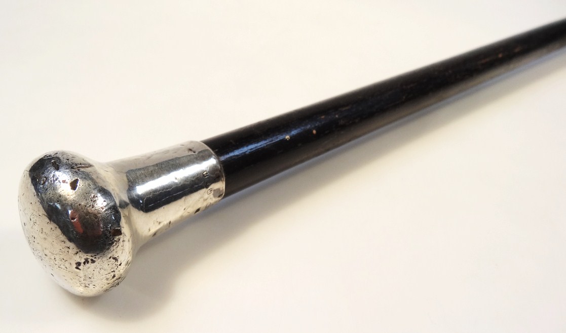 Appraisal: A George V ebonised walking stick of cylindrical form with