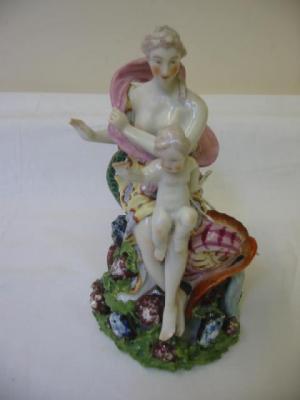 Appraisal: A CHELSEA STYLE PORCELAIN FIGURE modelled as a lady and