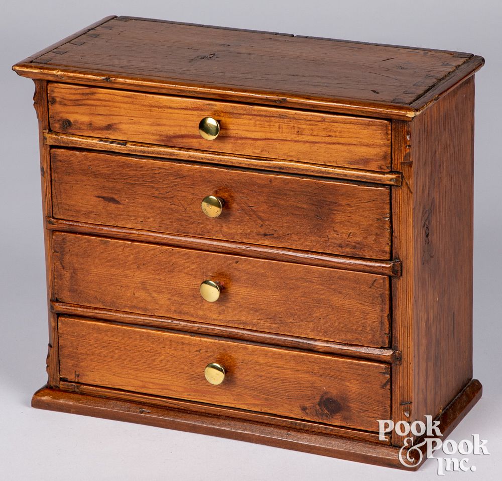 Appraisal: Miniature pine doll chest of drawers th c Miniature pine