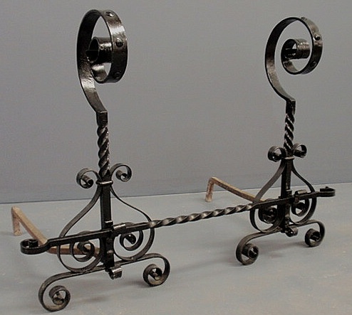 Appraisal: Pair of wrought iron scroll-form andirons with a removable horizontal