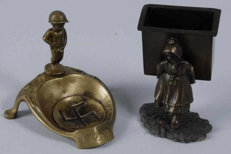 Appraisal: Pair of Bronze Figural Match Holder Ashtray Description Includes one