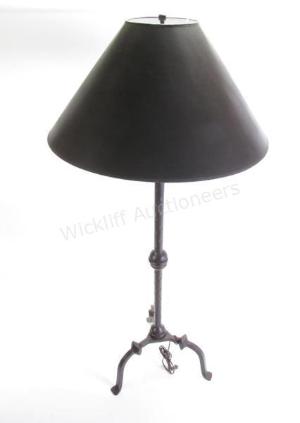 Appraisal: Antique style floor lamp with a hammered cast iron pedestal