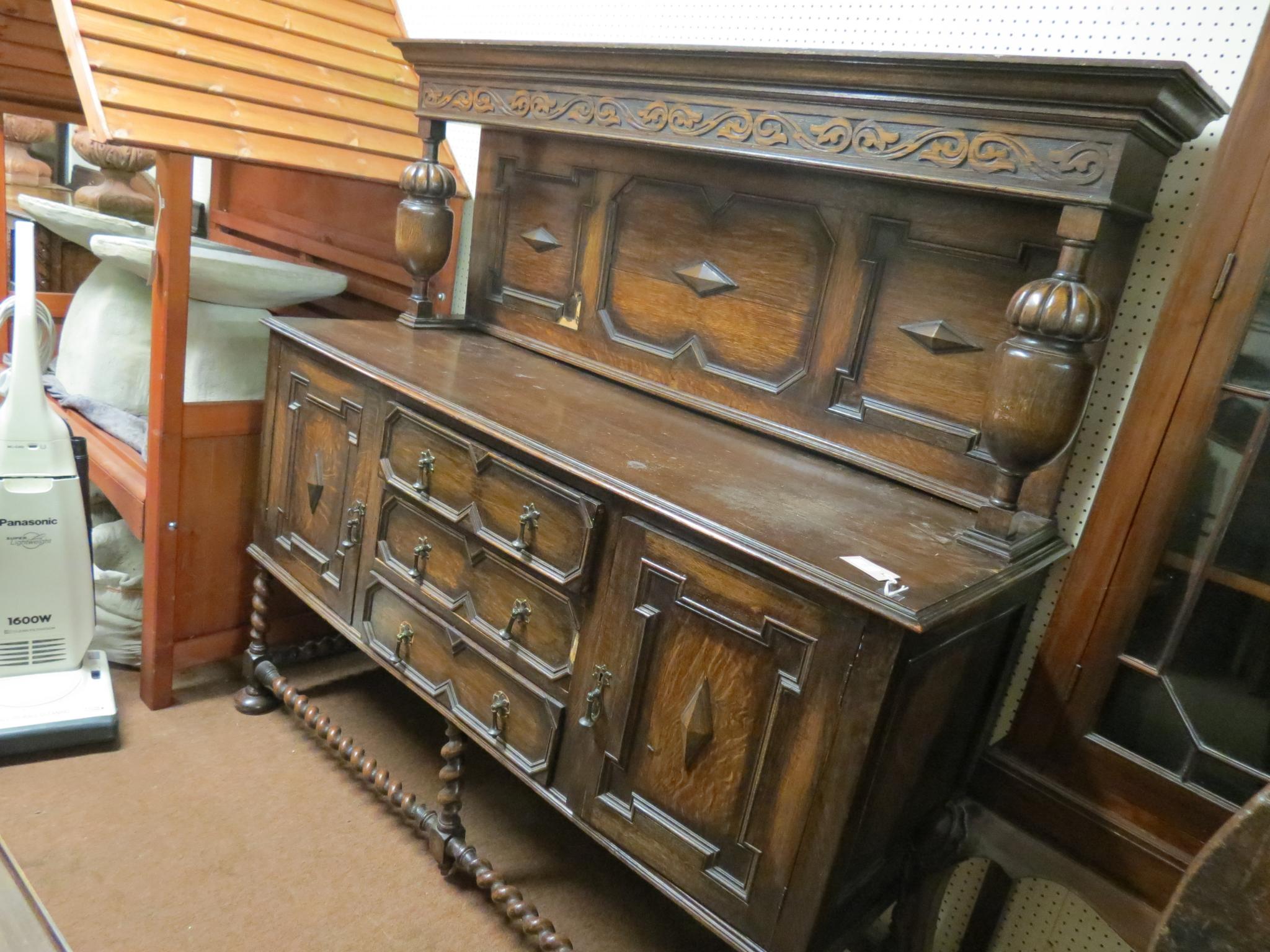 Appraisal: An early th century solid dark oak dresser panelled superstructure