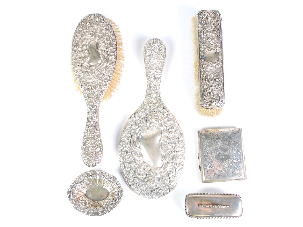 Appraisal: EDWARDIAN SILVER BACKED DRESSING TABLE HAND MIRROR AND MATCHING HAIR