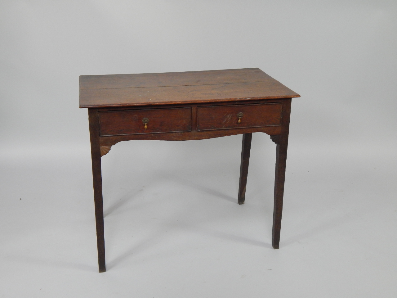 Appraisal: An thC oak side table with two frieze drawers raised