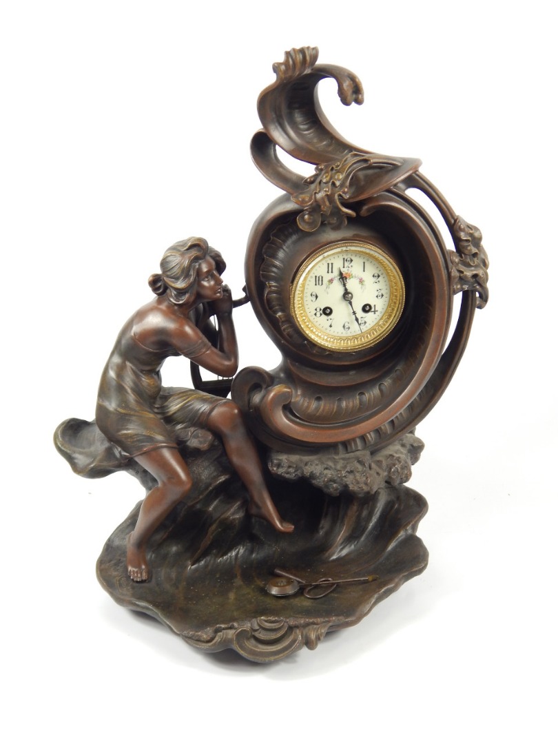 Appraisal: An early thC Continental spelter figural mantel clock depicting lady