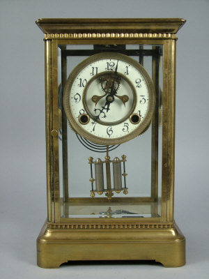 Appraisal: A brass four glass mantel clock early th century the