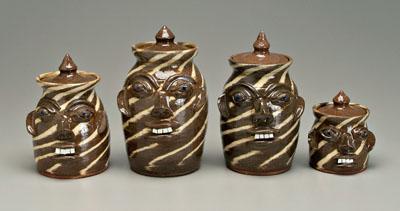 Appraisal: Four lidded stoneware face canisters swirled pottery broken china teeth