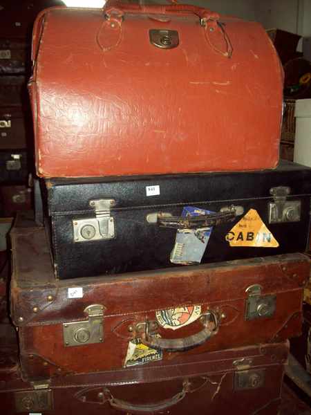 Appraisal: A SELECTION OF SEVEN LEATHER SUITCASES