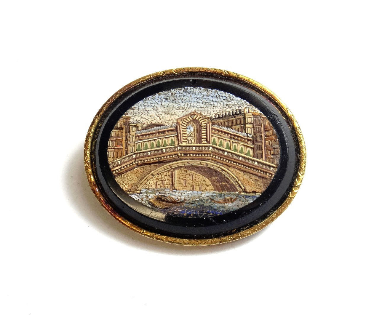 Appraisal: A gold mounted oval micro-mosaic brooch designed as a river