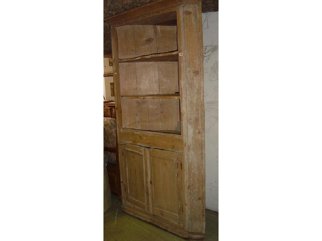 Appraisal: A Georgian stripped free standing corner cupboard the lower section