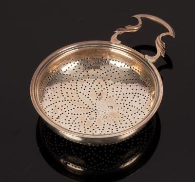 Appraisal: A George III silver strainer London with pierced handle and