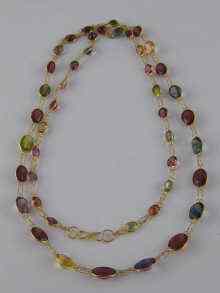 Appraisal: A yellow metal tests carat gold multi gem necklace approx