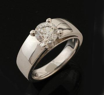 Appraisal: A diamond solitaire ring The round brilliant cut diamond weighing