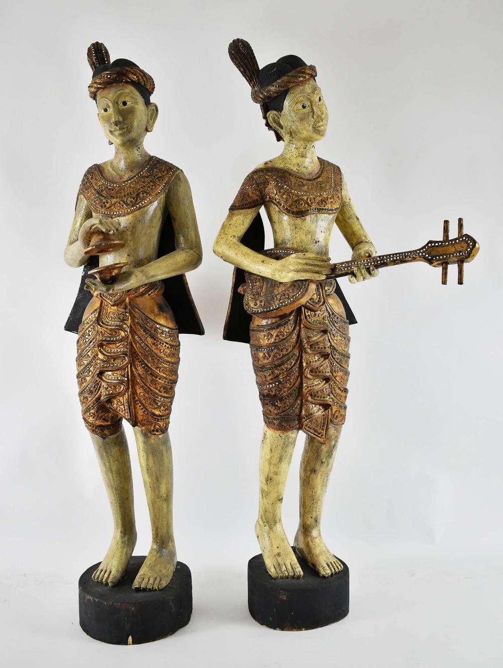 Appraisal: PAIR OF PAINTED PARCEL GILT WOOD BURMESE MUSICIANS th Century