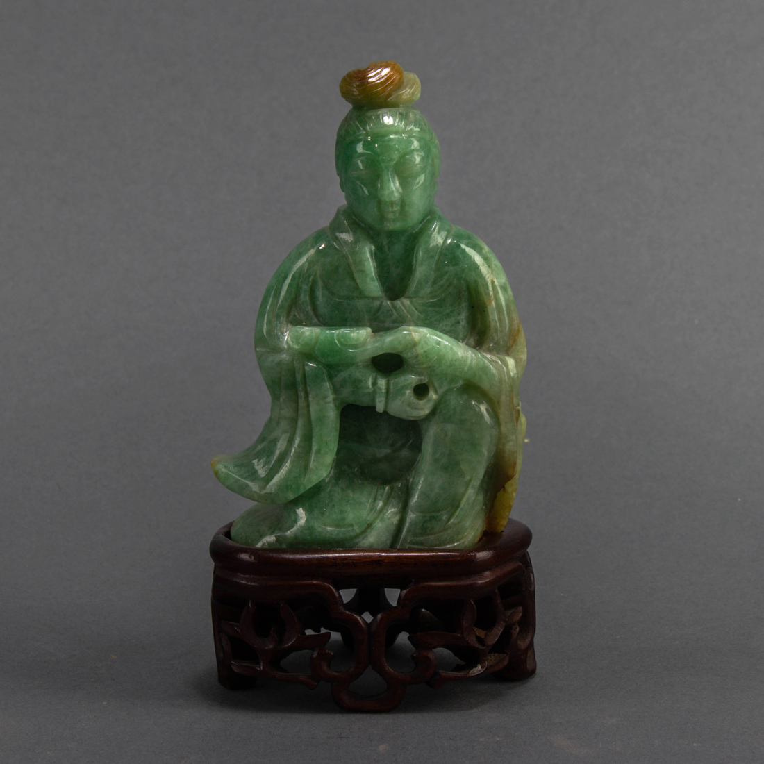 Appraisal: CHINESE JADEITE FIGURE Chinese jadeite figure carved as a seated