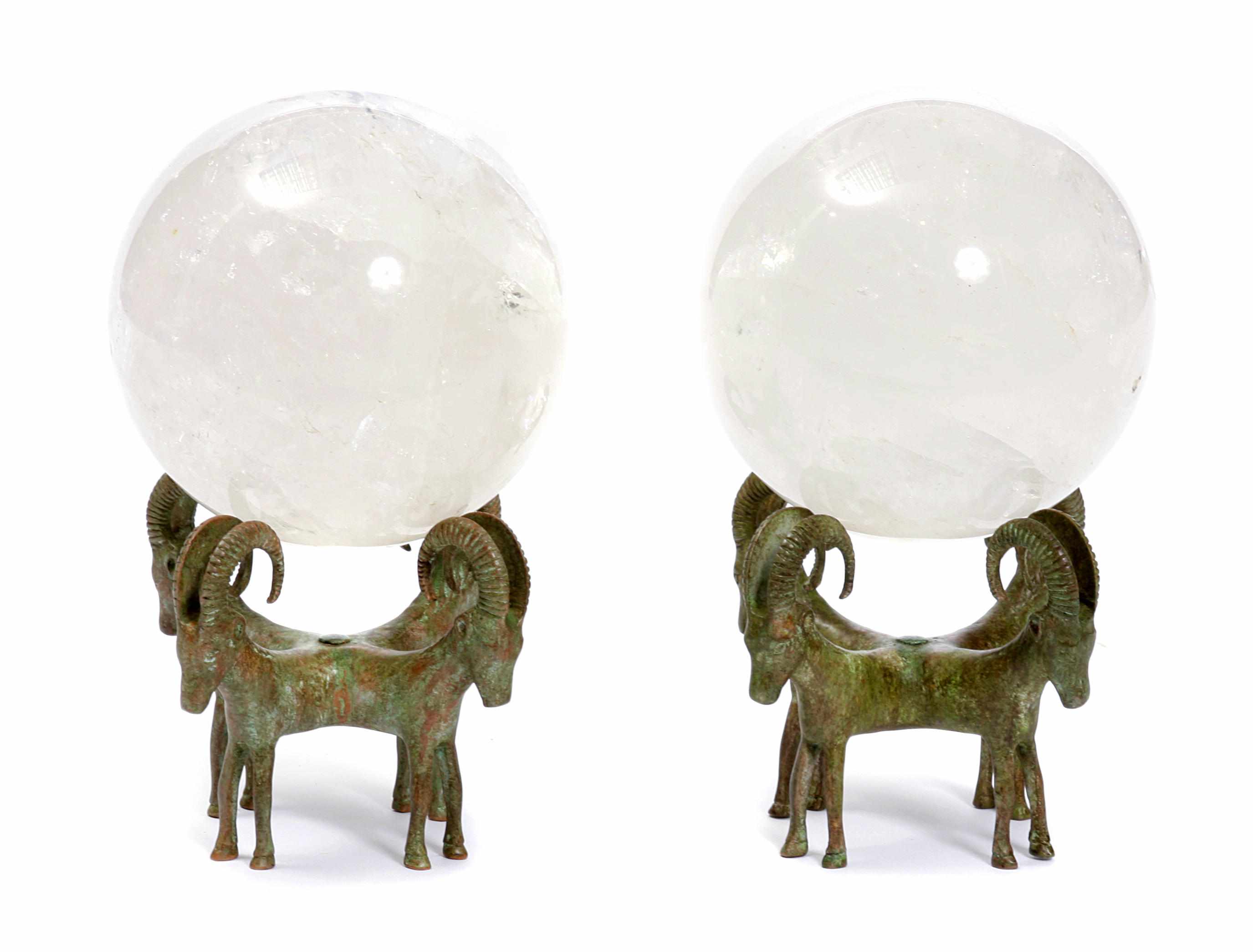 Appraisal: A pair of rock crystal orbs on bronze bases overall