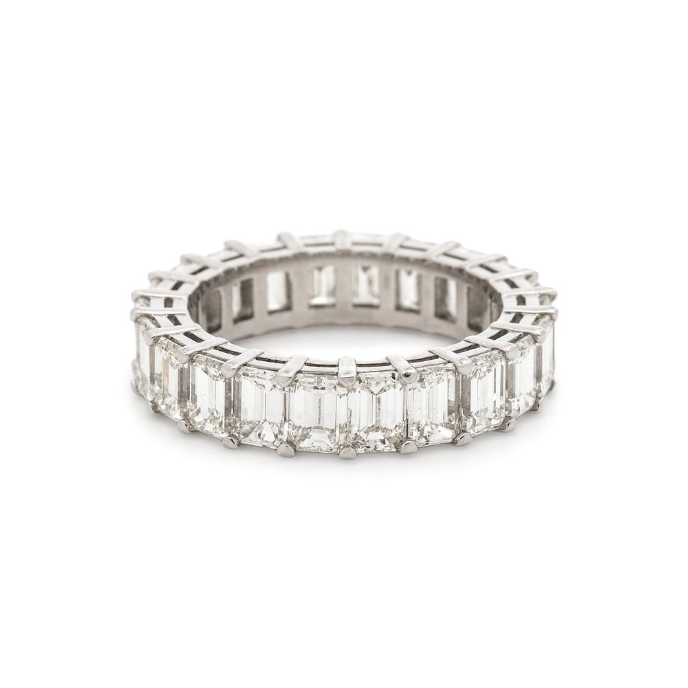 Appraisal: DIAMOND ETERNITY BAND DIAMOND ETERNITY BAND Containing emerald cut diamonds