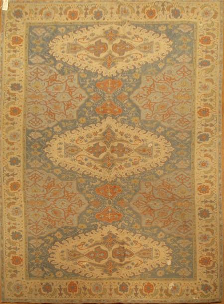 Appraisal: A kilim with three cream medallions on a light blue