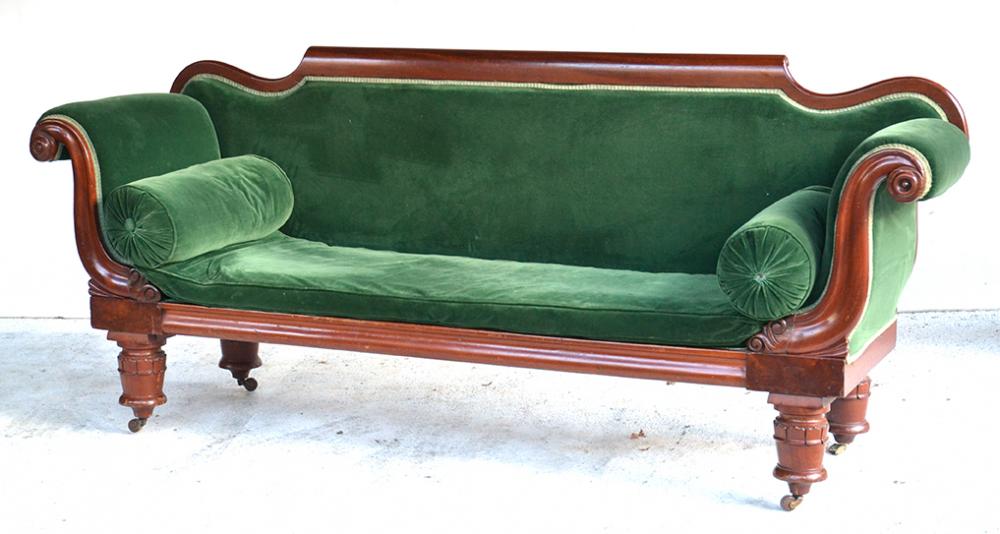 Appraisal: AN AUSTRALIAN CEDAR SOFA IN GREEN UPHOLSTERY C ONE CASTOR