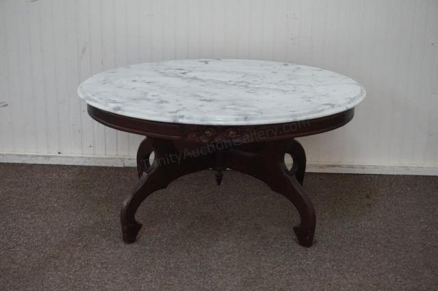 Appraisal: Rose Carved Mahogany Marble Top Coffee Table Victorian style produced