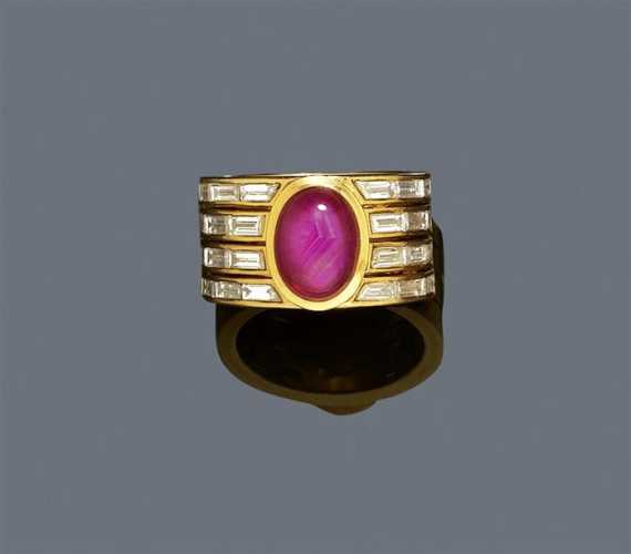 Appraisal: RUBY AND DIAMOND RING P CLARD Yellow gold Casual-elegant band