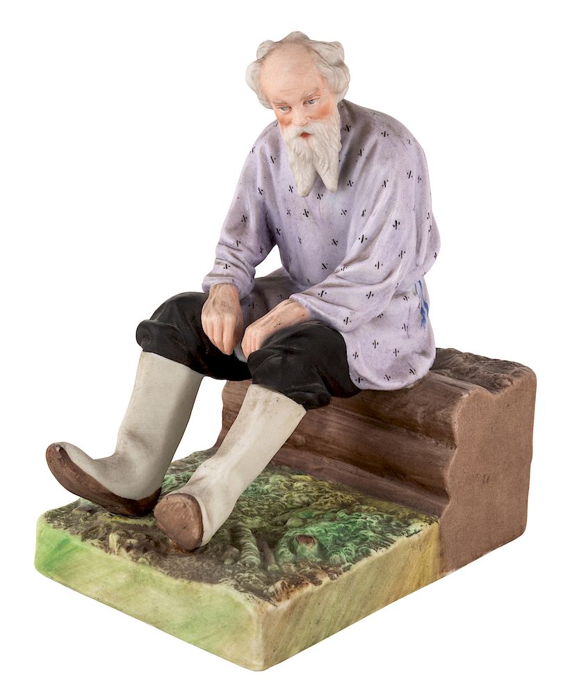 Appraisal: A RUSSIAN PORCELAIN FIGURE OF AN OLD MAN ON A