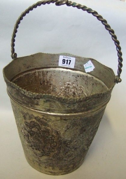 Appraisal: A Persian bucket with engraved decoration a shaped rim and