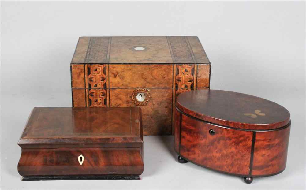 Appraisal: BURRWOOD AND EBONY OVAL SEWING BOX the hinged lid inset