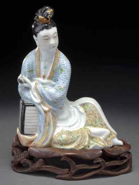 Appraisal: Chinese Republic famille rose porcelain figuredepicting a Guanyin holding a