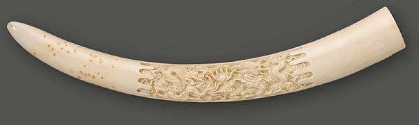 Appraisal: A carved ivory tusk th Century Decorated to one side