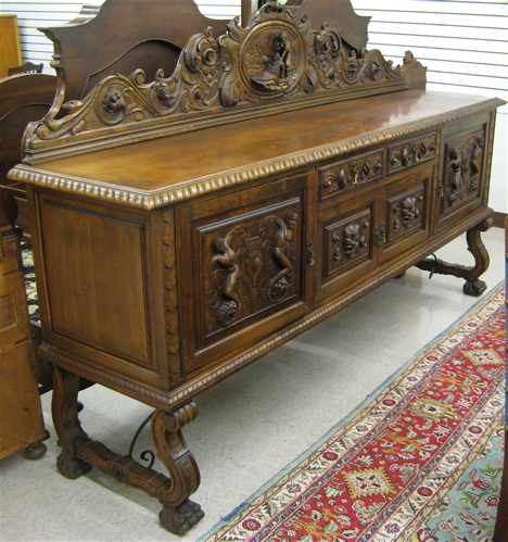 Appraisal: SPANISH BAROQUE STYLE WALNUT SIDEBOARD Continental mid th century with