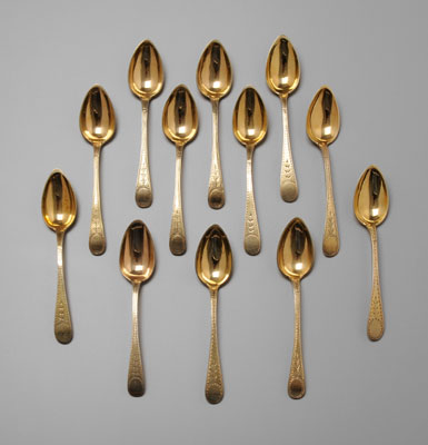 Appraisal: Twelve Gilt Sterling Spoons oval engraved handles marked Sterling and