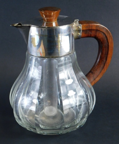 Appraisal: A thC serving jug with silver plated mounts wooden handle