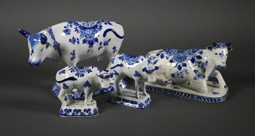 Appraisal: Lot of four Dutch Delft blue and white porcelain cows