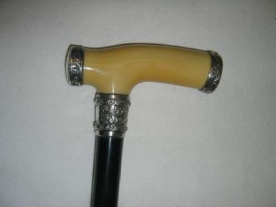 Appraisal: A LATE VICTORIAN PRESENTATION WALKING STICK the turned ivorine grip