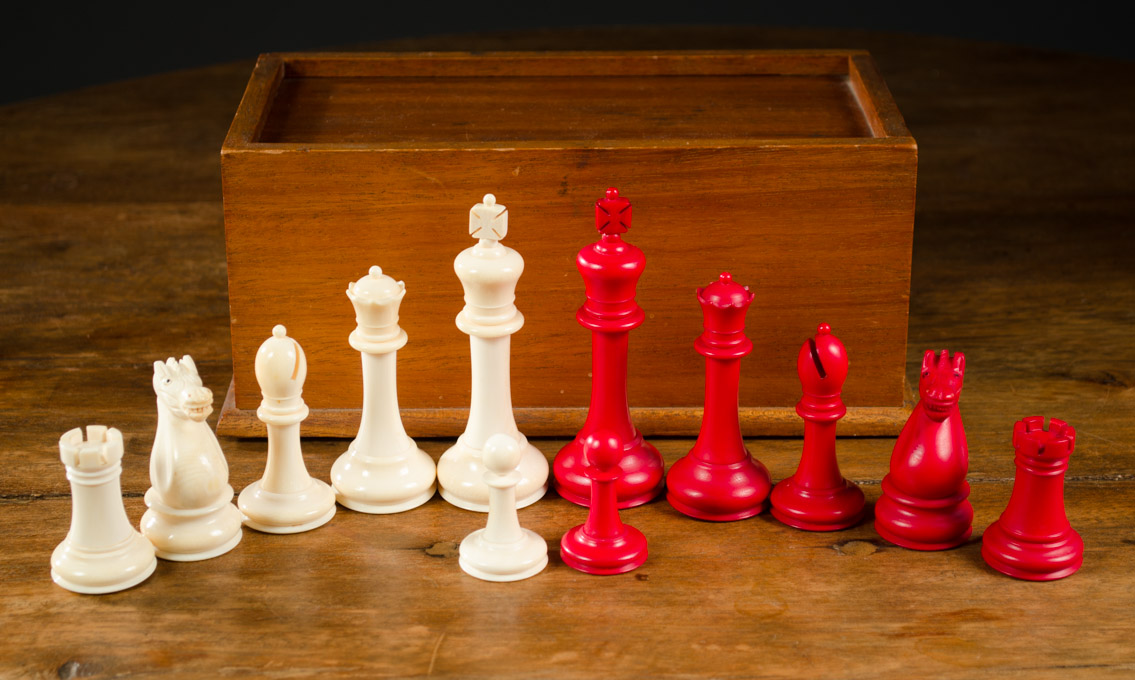 Appraisal: CARVED IVORY STAUNTON TYPE CHESS SET in wood casket complete