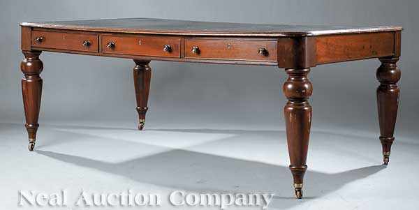 Appraisal: An English Mahogany Library Table the inset leather top above