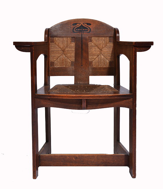 Appraisal: A LATE VICTORIAN ARTS CRAFTS OAK WALNUT OPEN ARMCHAIR designed