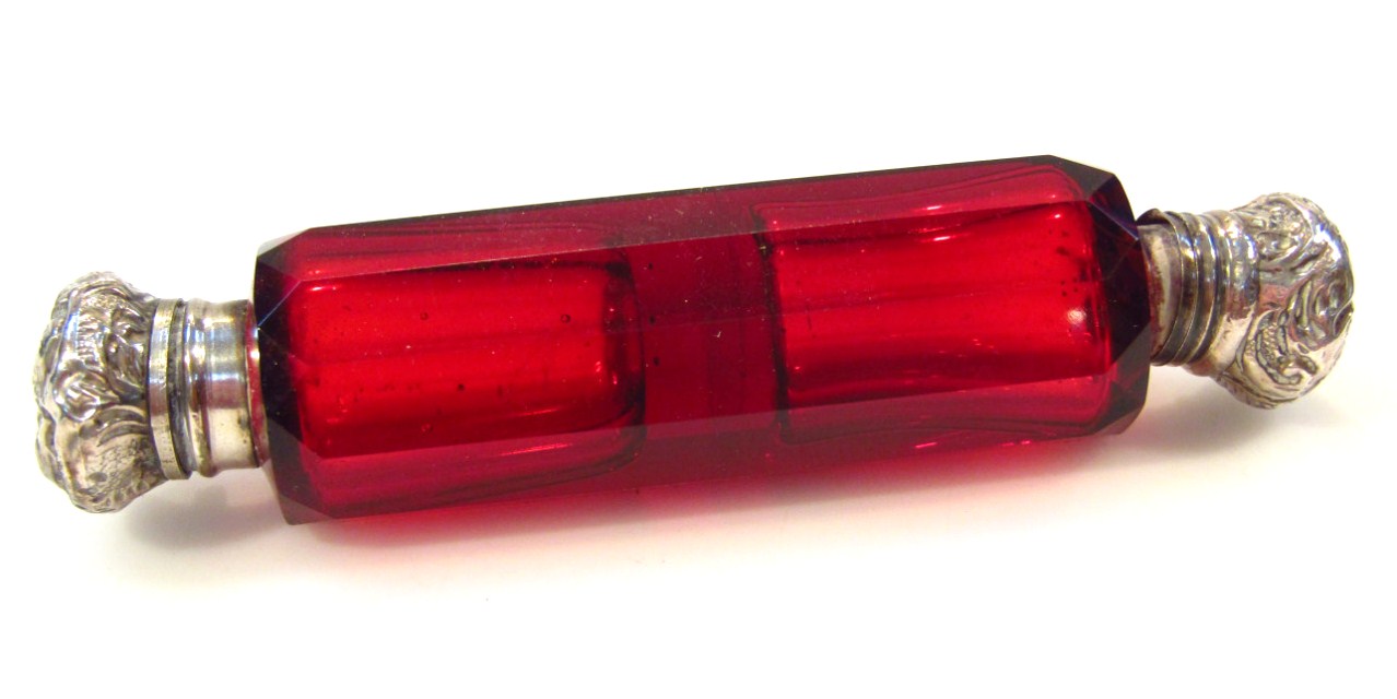 Appraisal: A Victorian cranberry glass double ended scent bottle the shaped