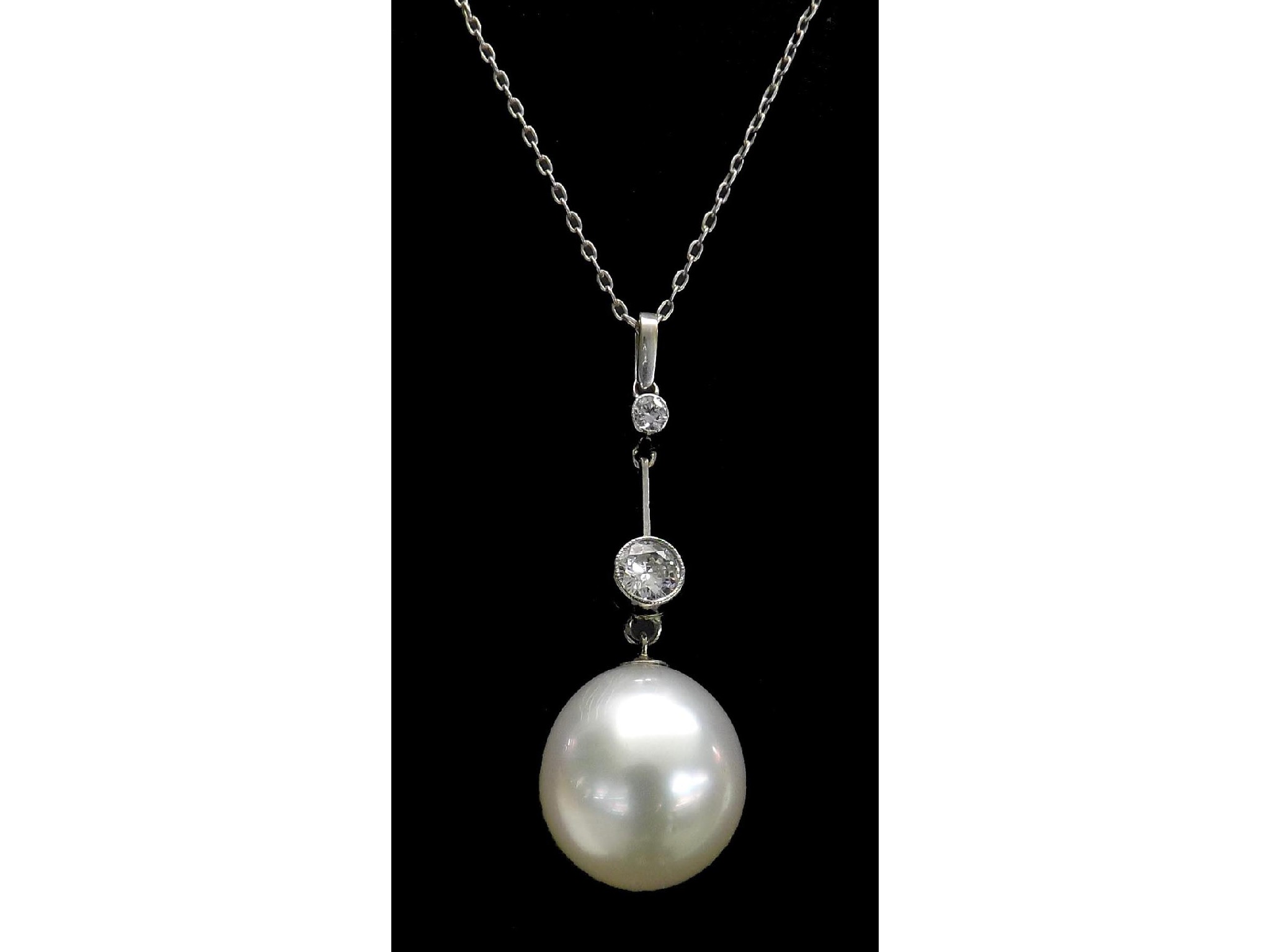 Appraisal: Cultured pearl and diamond pendant with two round-cut diamonds over