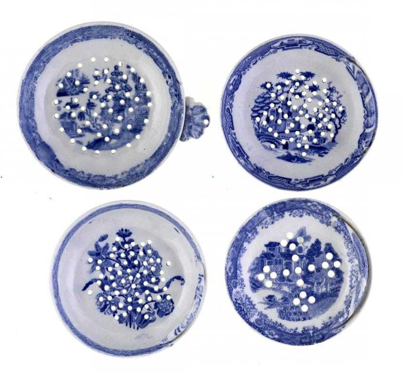 Appraisal: FOUR SPODE AND OTHER BLUE PRINTED EARTHENWARE EGG DRAINERS the