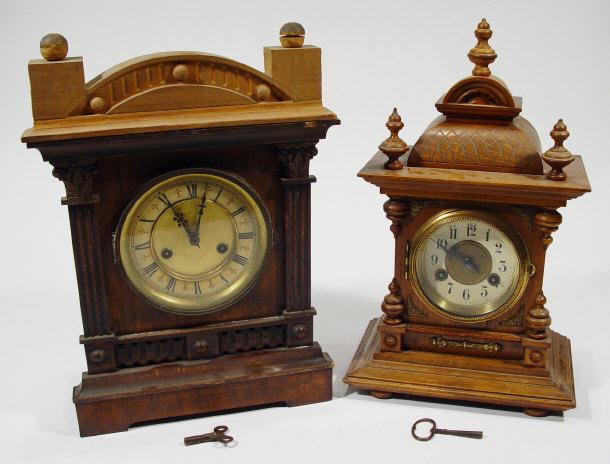 Appraisal: Two Edwardian mahogany cased chiming mantel clocks both with metal