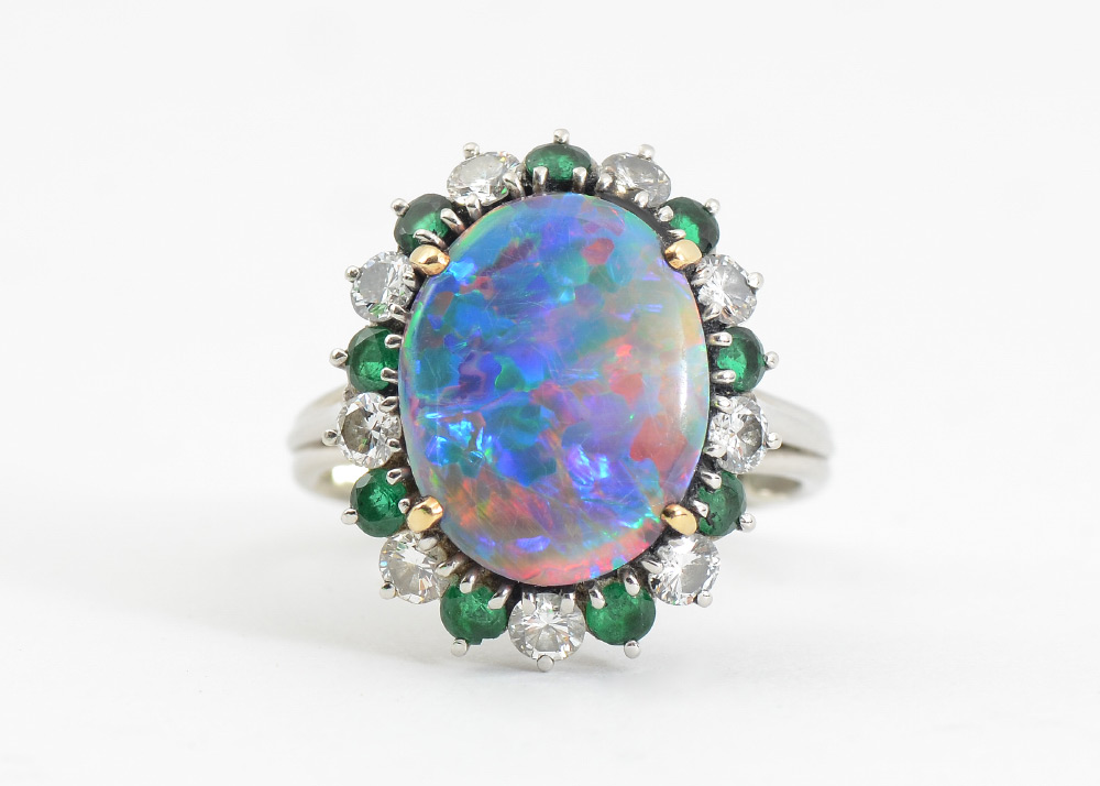 Appraisal: PLATINUM OPAL EMERALD AND DIAMOND RING Custom platinum ring centering