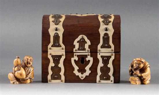 Appraisal: Two Japanese carved bone netsukes and a Continental ivory and