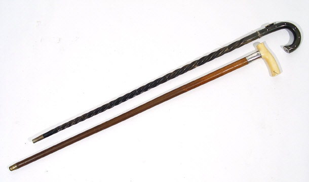 Appraisal: Barleytwist horn walking stick together with a malacca walking cane